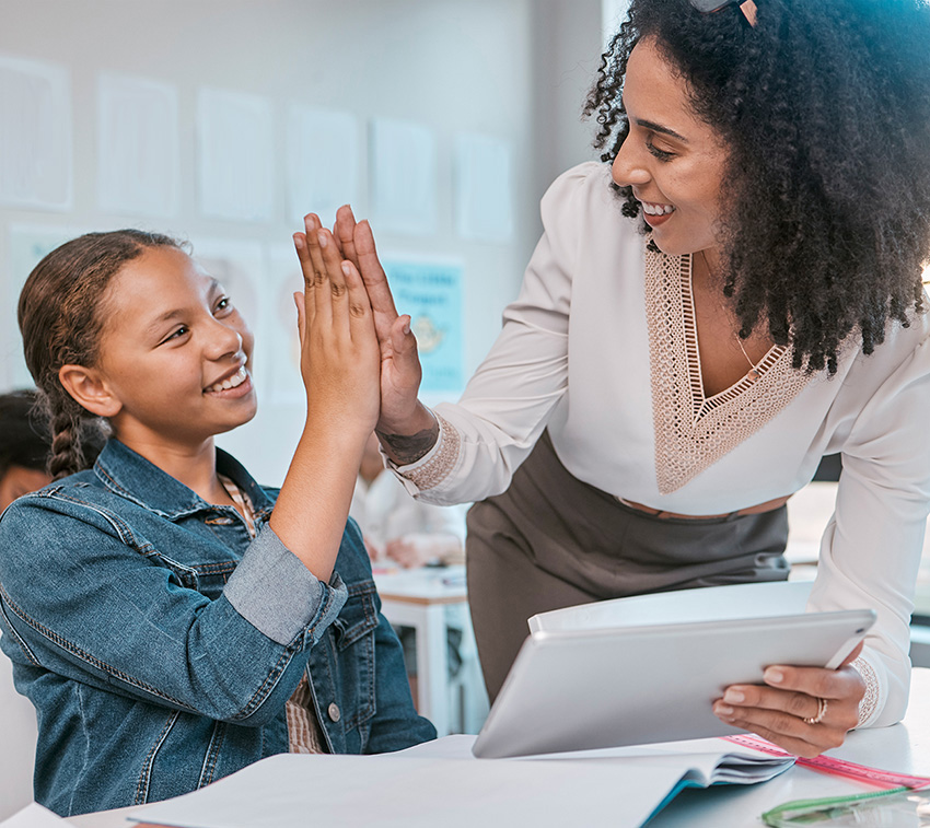 Teacher and student looking at tablet